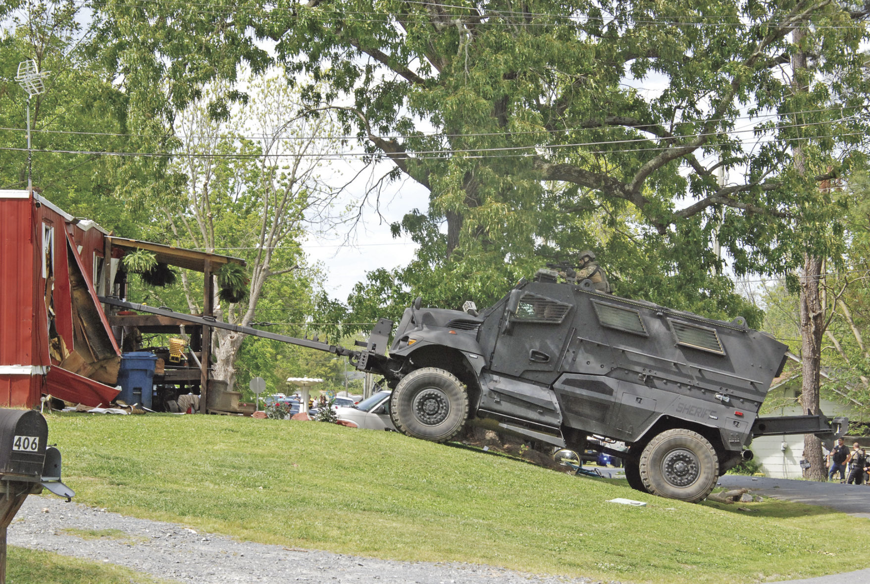 Man, woman, juvenile barricade themselves inside trailer.